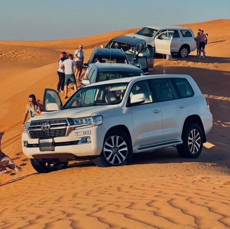 Land Cruiser on a dune at sunset on an Abu Dhabi desert safari