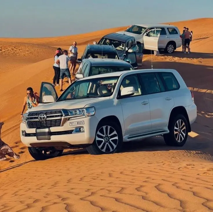 Land Cruiser on a dune at sunset on an Abu Dhabi desert safari