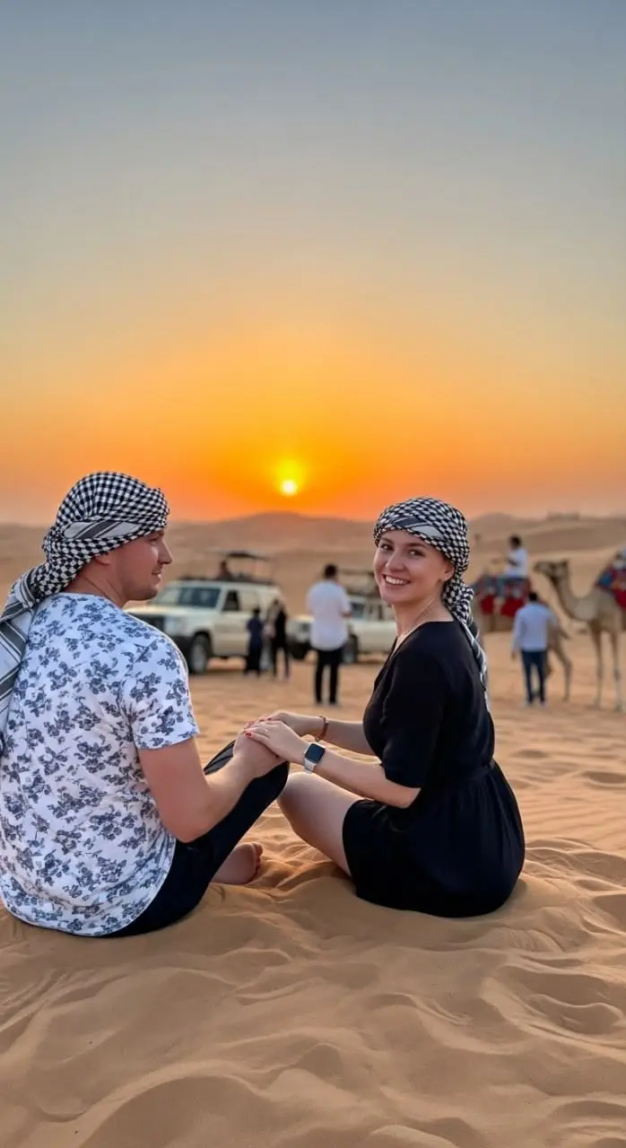 Couple on the red sand dunes of Lahbab on a Dubai desert safari
