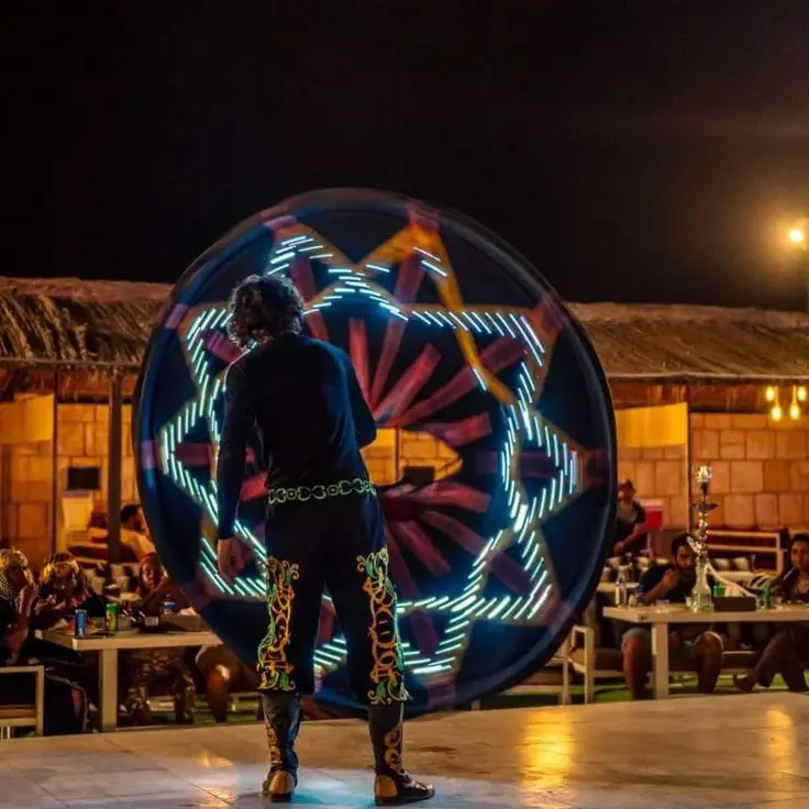 Live Tanoura and fire show at the desert camp