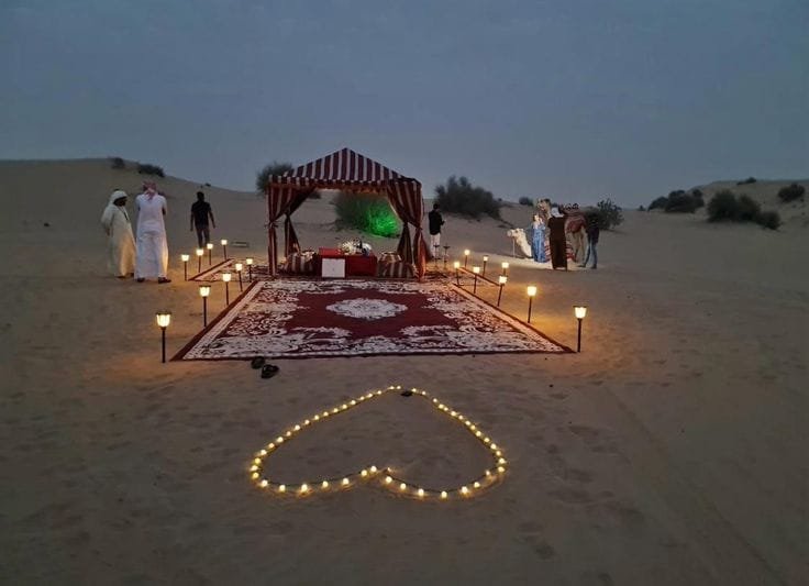 Desert camp lit up at night