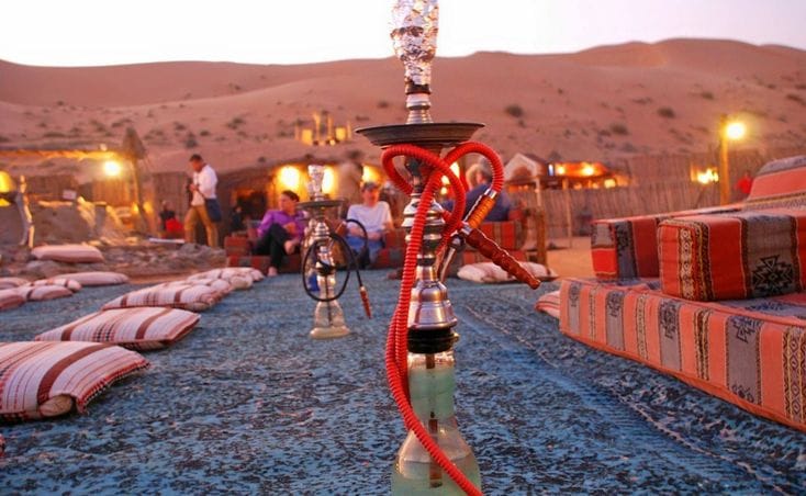 Guests enjoying shisha corner at desert camp Abu Dhabi