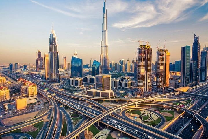 Aerial view of Downtown Dubai and Sheikh Zayed Road at sunrise with the Burj Khalifa