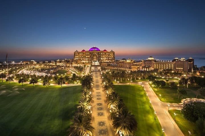 Emirates Palace and its floodlit gardens in Abu Dhabi