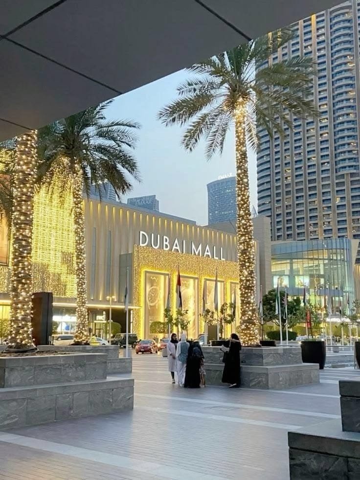 The Dubai Mall lit up at night, where the half-day Dubai city tour ends