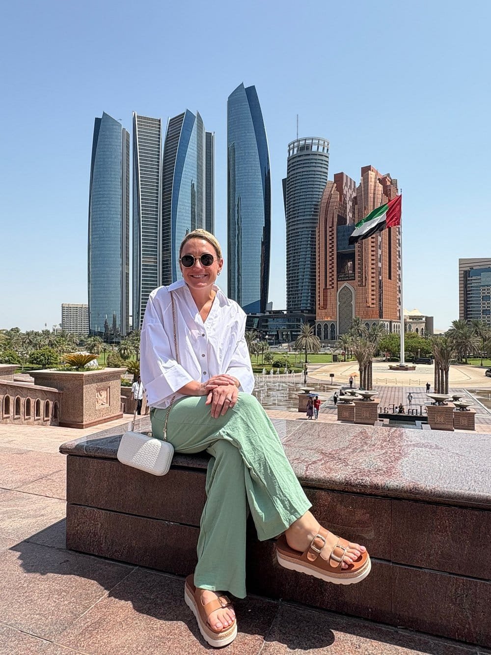 Guest on the Abu Dhabi Corniche with Etihad Towers behind