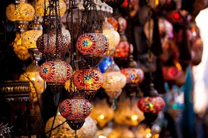 Hand-made mosaic lanterns hanging in a Dubai souk, browsed on the old Dubai city tour