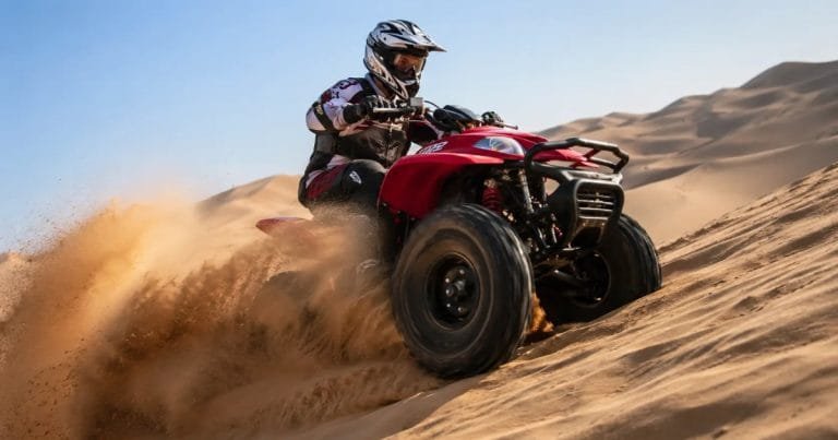 Quad bike rider on Dubai desert dunes, AED 200 single, 300 double